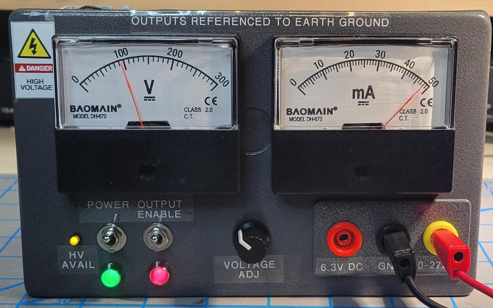 Final build showing high voltage power supply in operation supplying 100 volts to a 2K ohm load.