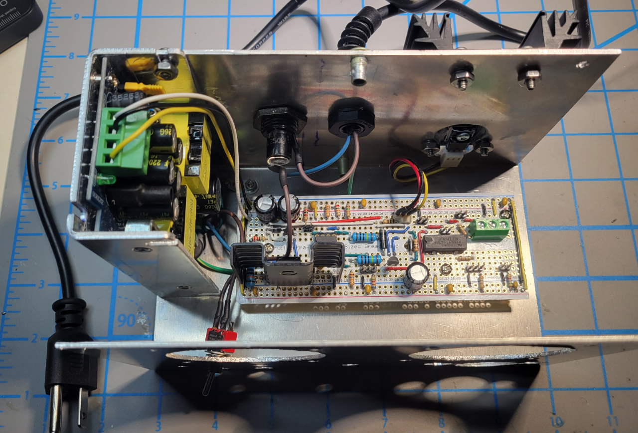Internal chassis with voltage regulator, VTPS, and power wiring installed.